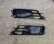 Gloss black and chrome front lower bumper fog light grilles
