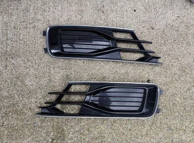 Gloss black and chrome front lower bumper fog light grilles