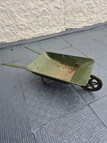 Vintage minature metal wheelbarrow