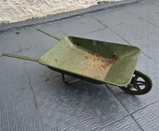 Vintage minature metal wheelbarrow