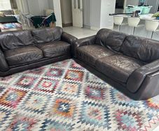 Two Italian leather 3 seater sofas