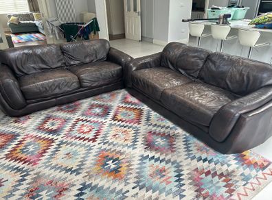 Two Italian leather 3 seater sofas