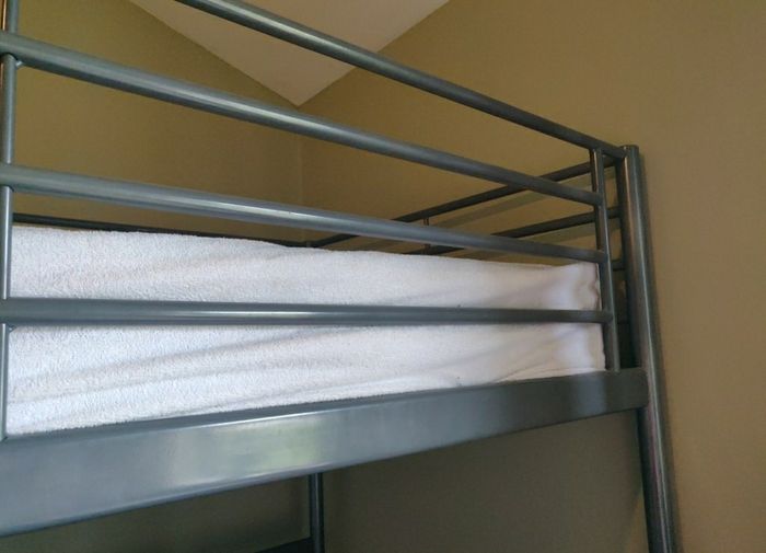 Over desk single bed.