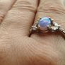 Ring made of 925 silver with oval opal of blue shade and cubic zirconia. Image 7