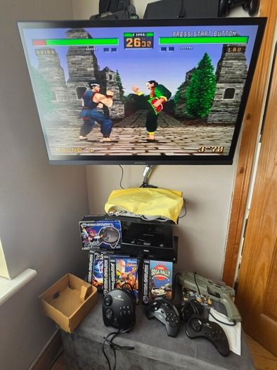 Sega Saturn w/ 3D Control Pad, Arcade Racer, Lightgun and Games