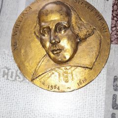 Bronze Coloured Wall Plaque of William Shakespeare with his Name and birth 1564 and death 1616 embossed on the front, Postage Available or Collection