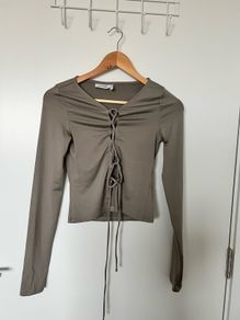 The lacing long sleeve top