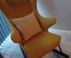Rocking accent chair designer Kare with matching foot stool