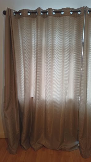 Textured light brown swirl patterned eyelet curtains from The Glenmount Collection made of polyester  size h 230cm, w 220cm (each)
