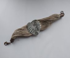 Handmade string bracelet in raw style. Leaf