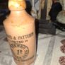 Antique stoneware ginger beer bottle from the Norfolk brewer Steward & Patteson Limited, featuring a "1D" (one penny) price mark Image 2