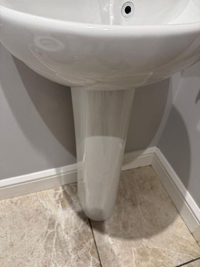 Bathroom sink, toilet, radiator