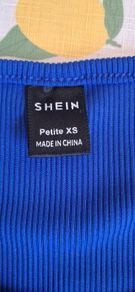 Blue top and skirt with split up side