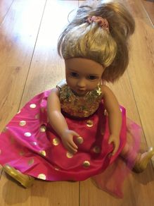 Doll in beautiful casual dress with sequins