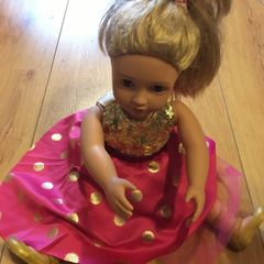 Doll in beautiful casual dress with sequins
