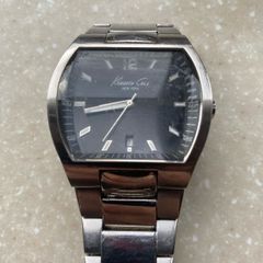 Kenneth Cole designer watch. Water Resistant. A few worn scratches but still working perfectly. Battery easily replaced and sits into the back of it.