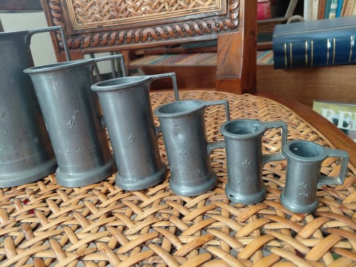 Antique French solid pewter measuring tankards Fleurs de lys complete set