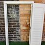 Vintage-style louvered white internal window shutter Image 5