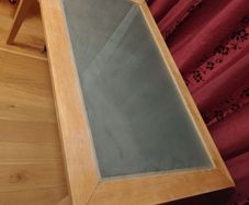 Wooden dinning table with glass.