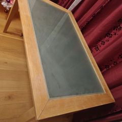 Wooden dinning table with glass.