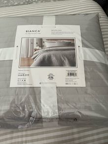 Cushion and quilted bedspread brand new