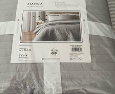 Cushion and quilted bedspread brand new