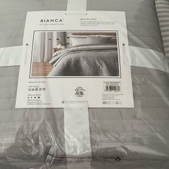 Cushion and quilted bedspread brand new