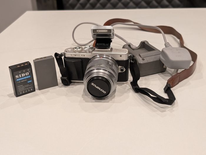 Olympus PEN Lite E-PL7 with 14-42mm lens and accessories