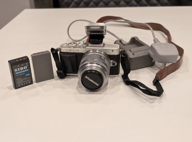 Olympus PEN Lite E-PL7 with 14-42mm lens and accessories
