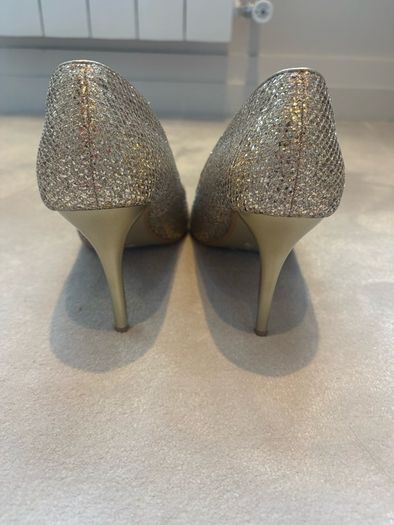 Gold glitter peep-toe heels.