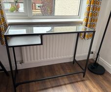 Glass console table with shelf