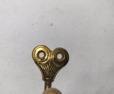Patient brass coat hangers