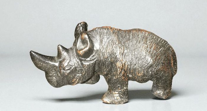 Small heavy rhino figurine