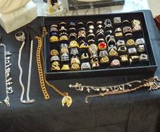Large Selection of Men's Dress Rings Charm Bracelets chains etc. all sold as a lot, not interested in selling separately Ideal for entertainment props or market sellers, Postage Available or Collection