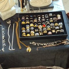 Large Selection of Men's Dress Rings Charm Bracelets chains etc. all sold as a lot, not interested in selling separately Ideal for entertainment props or market sellers, Postage Available or Collection