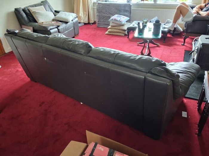 3 seater Black Brown Leather. Marks on back (but if against a wall, it doesnt matter!!)