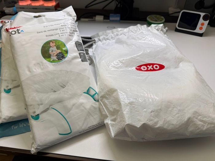Oxo travel potty potty training foldable with 100 disposable bags