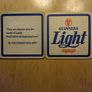 Guinness Light pint glass and beer mats Image 2