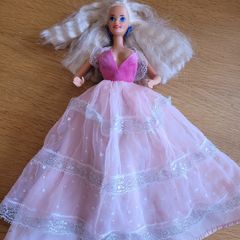 Vintage Barbie with blond hair and princess dress