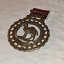 Antique solid brass camel medallion Image 2