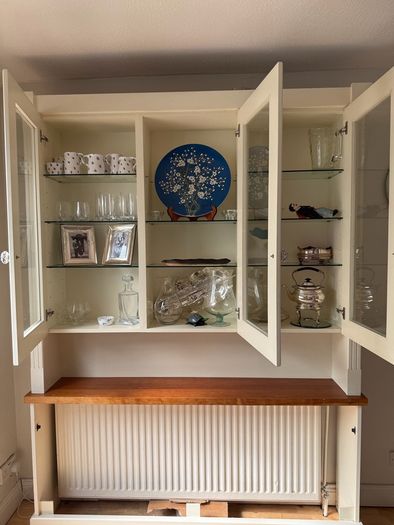 Radiator cover and display unit