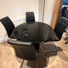 Black glass dining table, chrome legs and 4 chairs