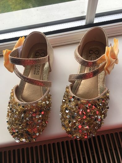 . Brand new in box , pair of girls gold shoes