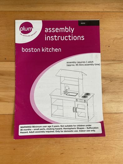 kids play kitchen by Plum with wooden food accessories