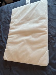 Mattress for a travel cot