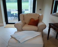 cream armchair 105cm w x 83cm d (pair available) + footstool extra