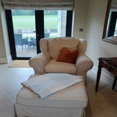 cream armchair 105cm w x 83cm d (pair available) + footstool extra