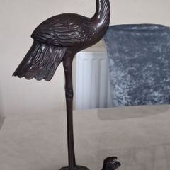 Sculpture of herring standing on a tortoise