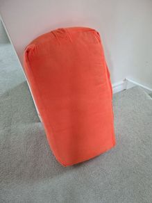Orange yoga bolster