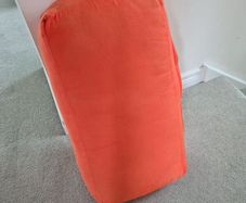 Orange yoga bolster